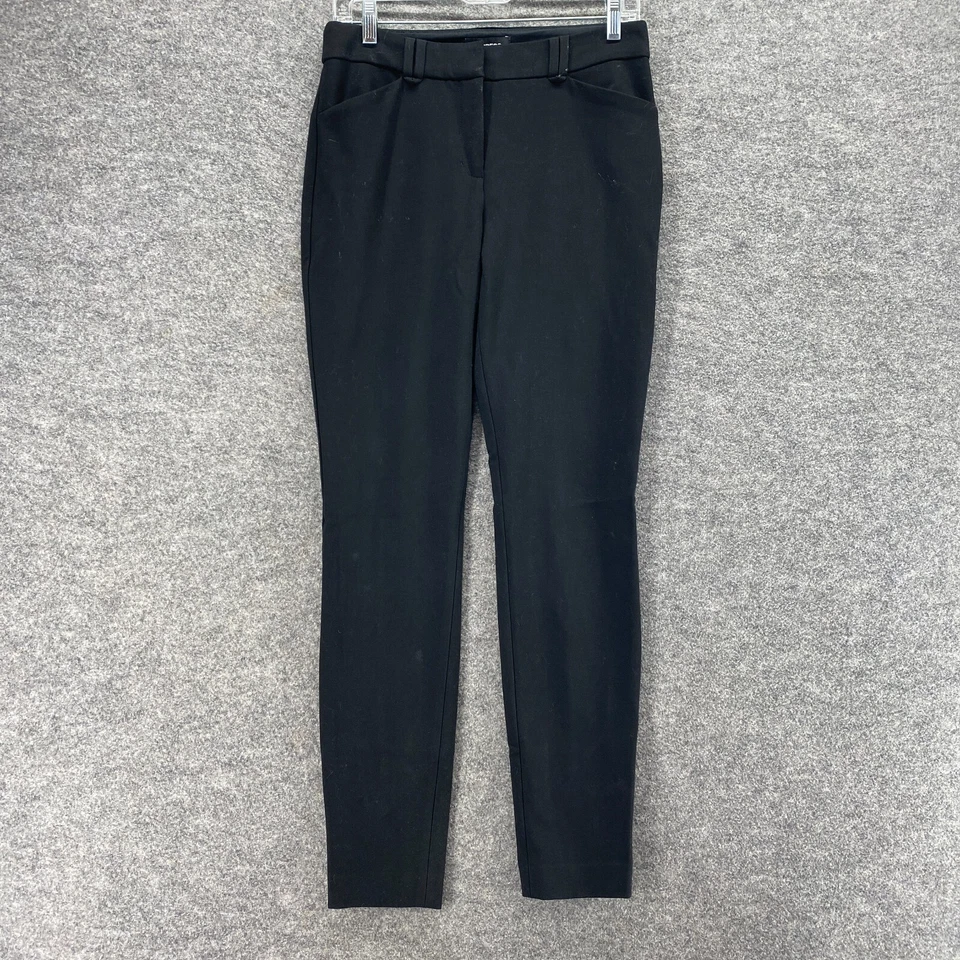 Pantalones Express para mujer 4 negros ajustados tiro medio bolsillos delanteros planos rayón informales Foto 1 de 4