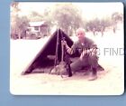 FOUND COLOR PHOTO H+1307 SOLDIER POSED CROUCHING BY TENT WITH RIFLE