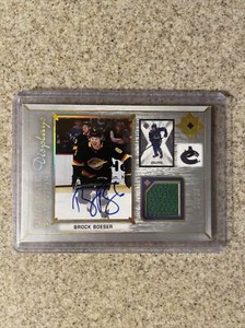 2021-22 Ultimate Collection Brock Boeser Ultimate Display Jersey Auto 64/65