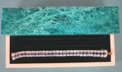 Brazalete tenis Suzanne Somers tono dorado cristal y piedra azul en caja Foto 1 de 3