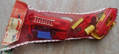 Vintage 1950 Mesh CHRISTMAS STOCKING  w Toy Cars Boat Fire Dump Truck Vehicles - Image 1 of 4