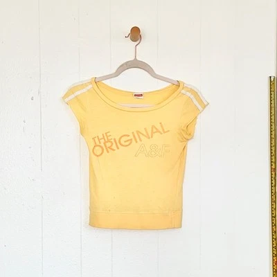 Camiseta de bebé amarilla Abercrombie & Fitch de colección de la década de 2000 S ultra rara vendedor de Estados Unidos Foto 1 de 4