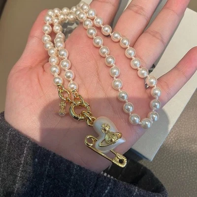 Vivienne Westwood Heart Orb Safety Pin Golden Pendant Pearl Necklace Pre-owned - Image 1 of 4