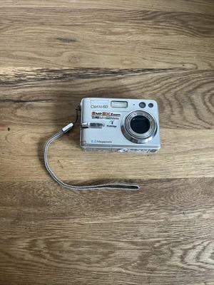 Pentax Optio 60 Digitalkamera 6.0MP mit Zubehörpaket: Anleitung / SD 256MB - Bild 1 von 4