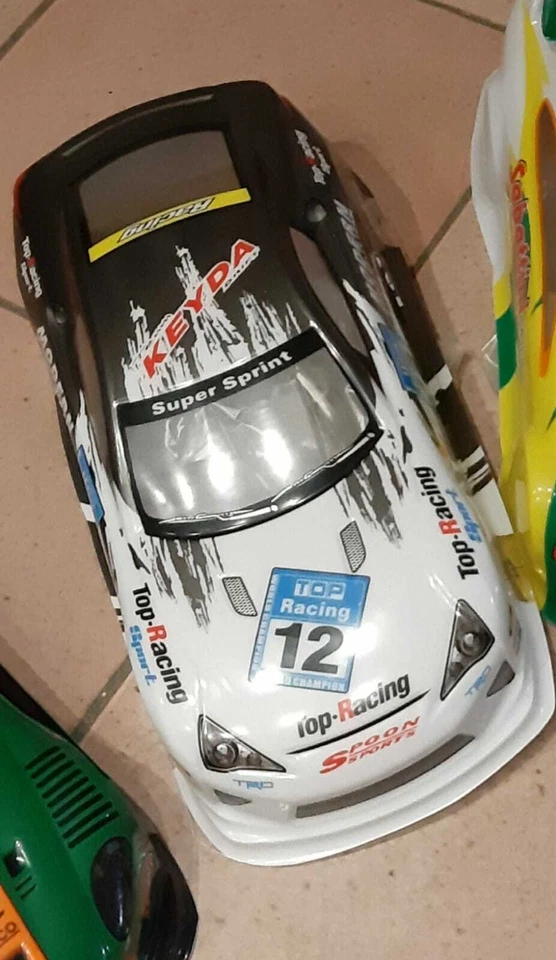 CARROZZERIA TOURING SCALA 1:10 XR04 BLACK AND WHITE XRACE  - Immagine 1 di 1