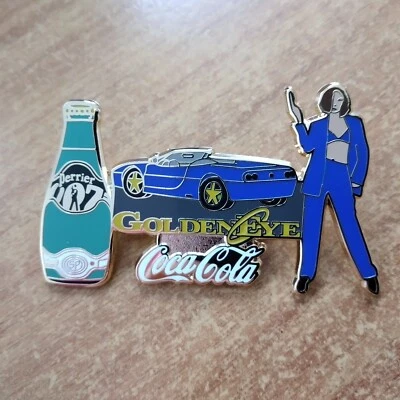 1 COCA COLA MIT PERRIER JAMES BOND GOLDEN EYE PIN LIMITED EDITION - Bild 1 von 2