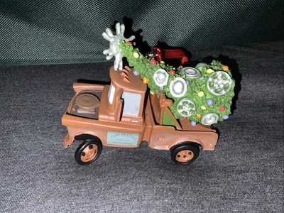 Disney Parks Pixar Cars TOW MATER w/CHRISTMAS TREE Ornament EXCELLENT CONDITION - Image 1 of 4