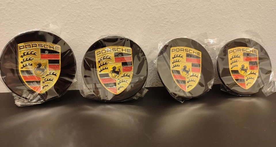 4x Coprimozzo originale NUOVI per Porsche Cayenne Panamera 911 76mm - Immagine 1 di 1
