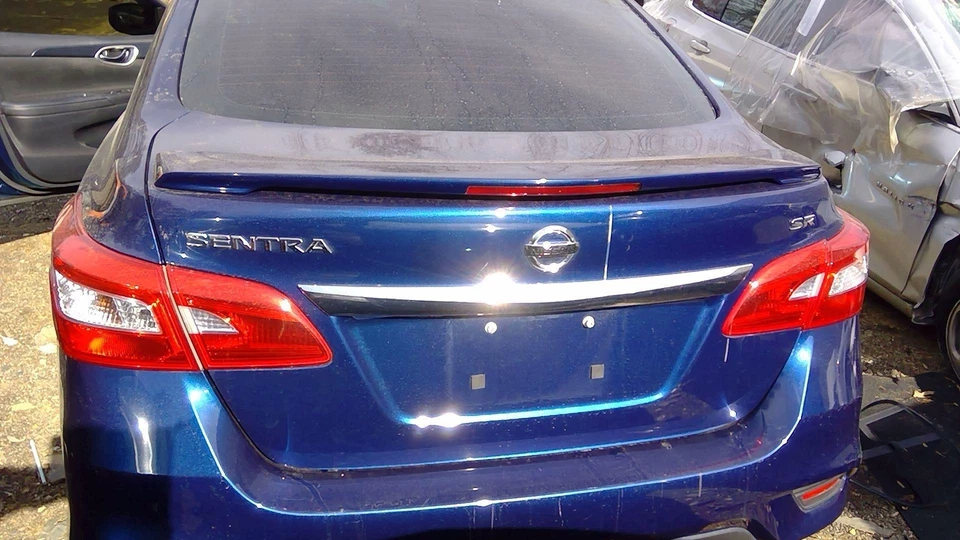 Крышка багажника в сборе темно-синяя RAY для Nissan Sentra SR 2016-2019 годов выпуска от оригинального производителя H43003SGCA - Изображение 1 из 4