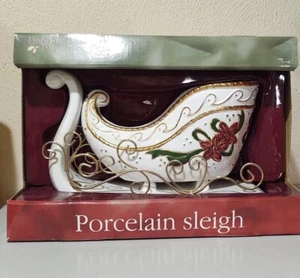 Vintage Holiday Time, 10" Porzellanschlitten weiß & gold mit Weihnachtsstern & Bändern sehr guter Zustand - Bild 1 von 1