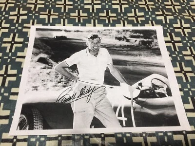 Carroll Shelby SIGNED PHOTO IN FRONT OF 1956 857S FERRARI RACER IMAGE! - Image 1 of 3