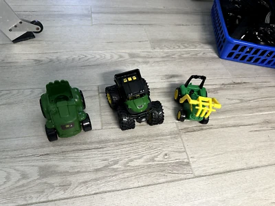 Lot of 3 John Deere 4-5" toys: monster thread gator,hay fork loader,mower. - Image 1 of 4