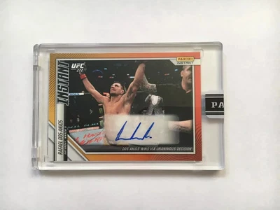 2022 PANINI INSTANT RAFAEL DOS ANJOS WINS BY UNANIMOUS DECISION ORANGE AUTO 4/10 - Image 1 of 2