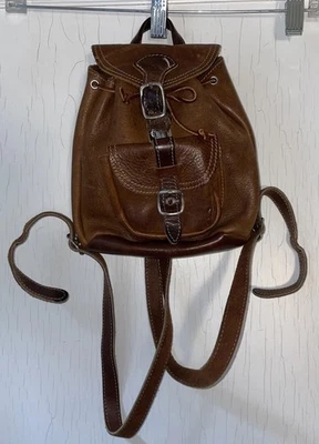 Vtg Unisex Roots Small Brown Leather Bag Backpack w/ Buckle Adjustable Straps - Image 1 of 4