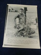 Wire Press Photo 1987 USA Carl Lewis Worlds Champs. long jump landing Rome Italy