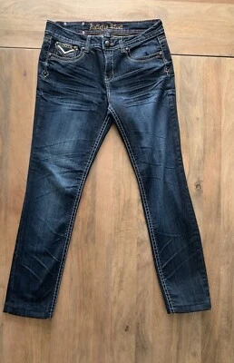 Pantalones de mezclilla antiguos de regimiento con remaches talla 30x29 embellecidos bolsillos con solapa lavado oscuro como una roca Foto 1 de 4