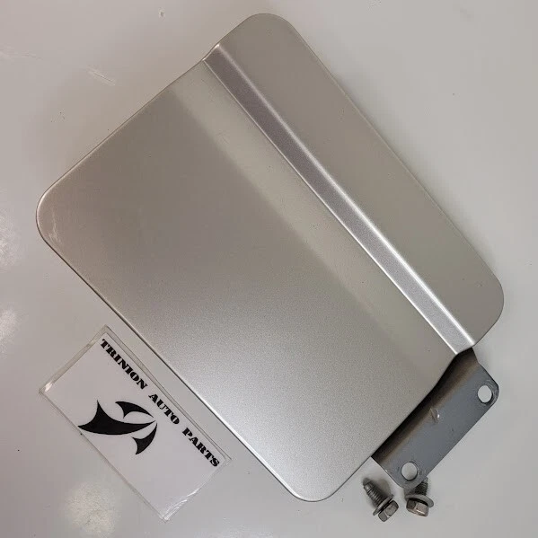 Nissan Pathfinder 1990-1995 puerta de combustible cubierta de gasolina plateada con tornillos OEM Foto 1 de 3