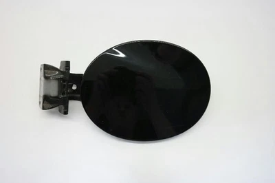 2010-12 MAZDA CX7 FUEL FILLER DOOR BLACK  - Image 1 of 4