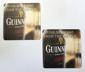 "Lote de 2 posavasos de cerveza Guinness directamente de la botella de 4"" x 4" - Imagen 1 de 2