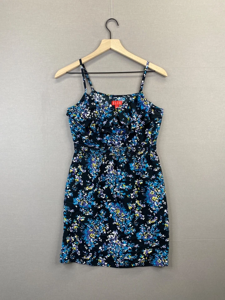 Camiseta sin mangas azul con volantes florales y bolsillos Elle para mujer sin mangas cuello en V talla pequeña Foto 1 de 4