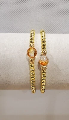 Pulseras chapadas en oro de 18 quilates con cuentas agrietadas naranjas y transparentes. Juego de 2 Foto 1 de 3