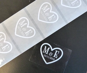 100 60MM X 35MM CLEAR STICKERS PERSONALISED WHITE HEART INITIALS WEDDING FAVOUR  - Picture 1 of 3