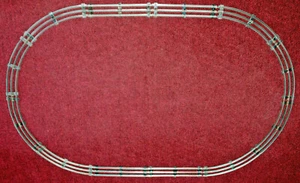 12 Pieces Of 0-27 Gauge Lionel Track, Oval Layout, Black Ties - Picture 1 of 3