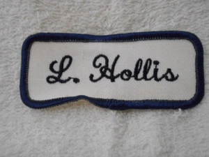 L. HOLLIS  USED EMBROIDERED  SEW ON NAME PATCH TAGS DARK BLUE ON WHITE - Picture 1 of 1