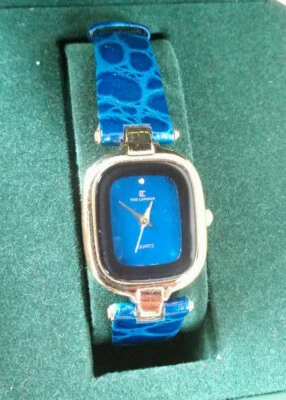 全新 未使用 原装盒 Ted Lapidus 金色 女式手表 蓝色皮革表带  — 第 1/4 张图片