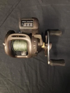 OKUMA AE-15D AVEON KOKANEE REEL W/ DEPTH COUNTER (B26002451) - Picture 1 of 6