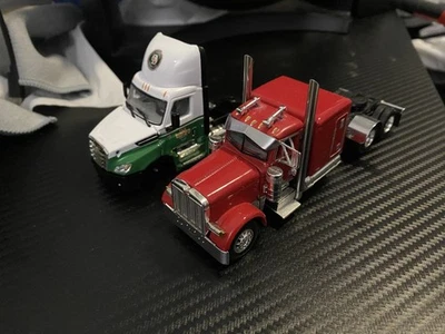 1/64 Scale DCP Red Peterbilt 379 & Old Dominions Freightliner sold as is  - Image 1 of 3