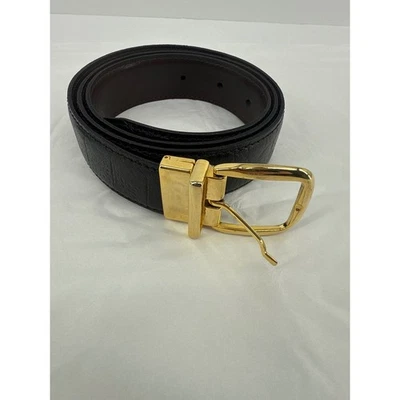 Cinturón reversible de diseñador negro cuero en relieve hebilla dorada para mujer talla 34/95 Foto 1 de 4