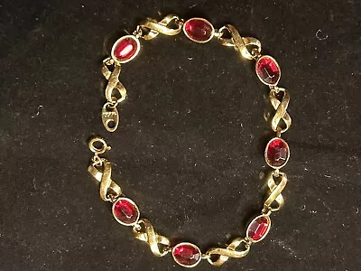 Avon gold bracelet with 7 ruby red rhinestones infinity bracelet w gift box 10J - Image 1 of 3