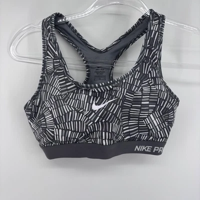 Sujetador deportivo mediano para mujer Nike Pro Dri-FIT gris negro blanco estampado geométrico Foto 1 de 4