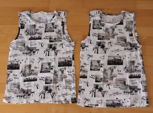 2 Ärmellose Jungen Shirts von H&M in weiß mit schwarzem Motivdruck in 158/164 - Bild 1 von 1