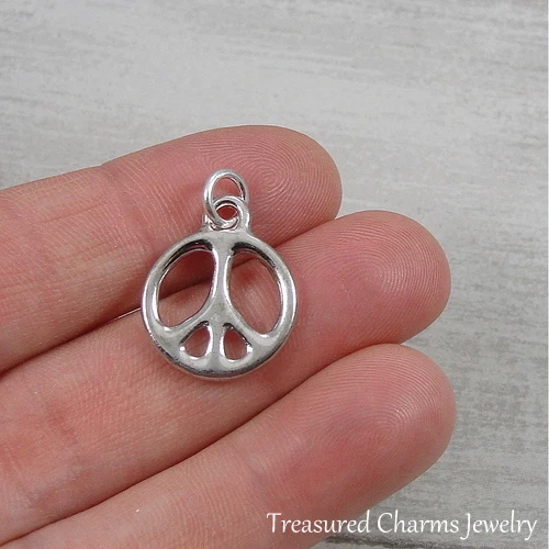Berloque símbolo sinal de paz pequeno prata - Pingente hippie anos 60 anos 70 paz mundial NOVO - Imagem 1 de 2