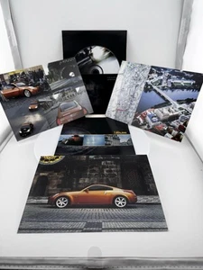 Nissan 350Z 2003 DVD in the run - anuncio comercial. Tarjetas postales - Imagen 1 de 10