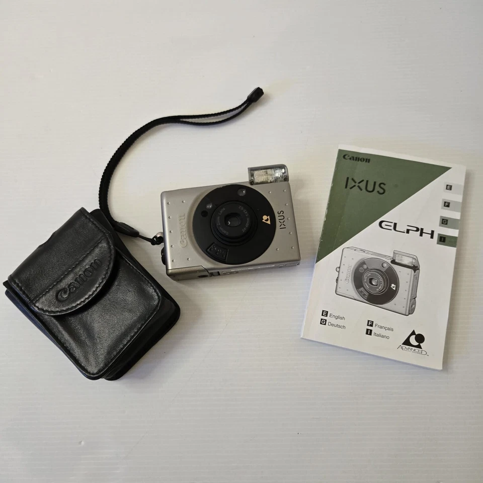 Canon IXUS APS Film Camera w/ Case & Manual – Powers On, Flash Sticks - Image 1 of 4