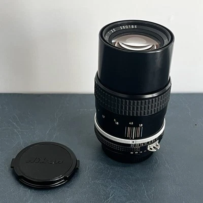 Nikon Nikkor AI 135mm f3.5 Lens TESTED, LATEST VERSION, built-in hood w/ caps - Image 1 of 4