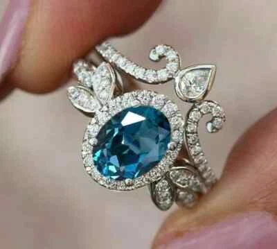 2CT Oval Cut Simulated Topaz Women's Wedding Halo Ring Set 14K White Gold Finish - Image 1 of 4