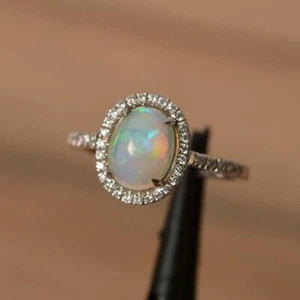 Anillo de ópalo natural anillo de halo de plata corte ovalado blanco anillo de compromiso de ópalo natural - Imagen 1 de 4