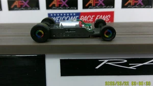 AFX RACING H.O. SCALE MEGA G+ 1.7 NARROW CHASSIS RAINBOW COLORED RIMS - Photo 1/5