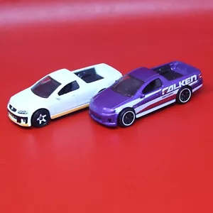 2 2021 Matchbox Holden UTE SSV 2010 White + Purple 1:64 MBX #64 Truck Series #6 - Picture 1 of 9