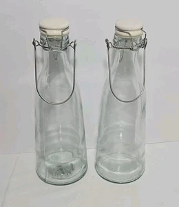Lote 2 botellas de vidrio transparente con tapas y abrazaderas metálicas 33,8 oz. G63 - Imagen 1 de 11