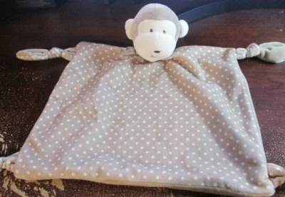 Manta de seguridad mono lunares marrón y blanco extremos anudados con sonajero (RARA) Foto 1 de 2