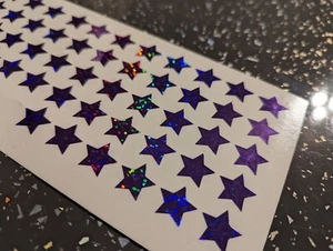 NEW SIZE - 60 X Holographic * Purple* Peel Off Stars 1.5cm x 1.5 cm 15 x 15 mm - Picture 1 of 3