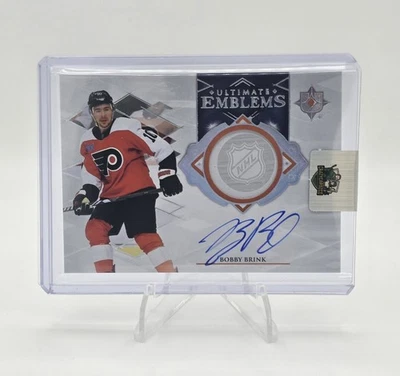 2023-24 Upper Deck Ultimate Collection Bobby Brink Emblems Auto #UE-BB - Image 1 of 2