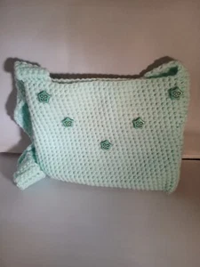Child's crocheted mint green purse with happy faces. - Picture 1 of 2