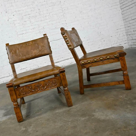 Vintage Spanish Revival Oak Pair of Chairs with Tooled Cognac Faux Leather Seat Cover