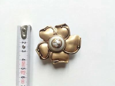 GUCCI FIBBIA FIORE E PERLA CON LOGO GG-BUCKLE GUCCI FLEUR AND PEARL WITH LOGO GG Foto 1 de 2